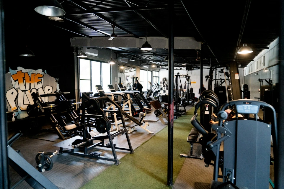 A gym filled with lots of machines and equipment